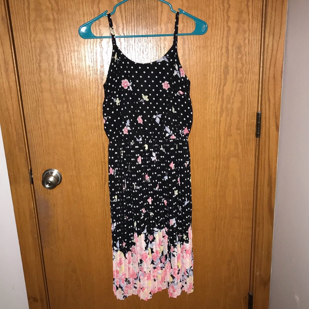 A black dress with white dots and flowers